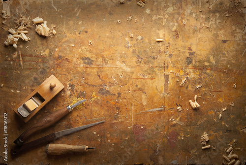 фотографія Hand tools Wood on an old wooden workbench