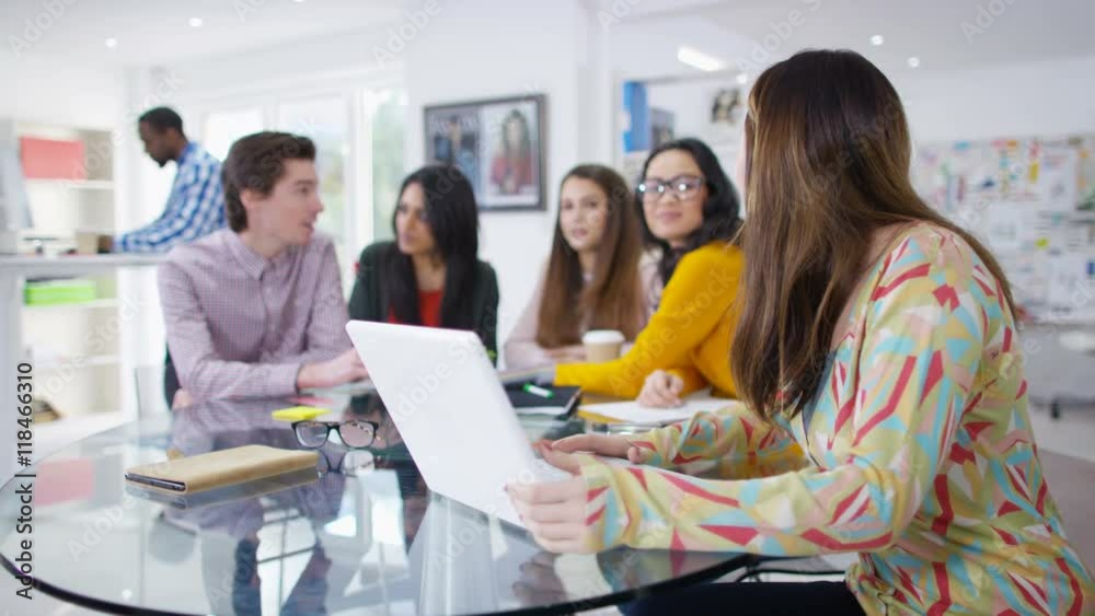 Portrait of smiling worker at a fashion magazine in office meeting Portrait of smiling worker at a fashion magazine in office meeting