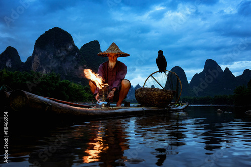 Fisherman of Guilin, Li River and Karst mountains during the blue hour of dawn,Guangxi  China photo