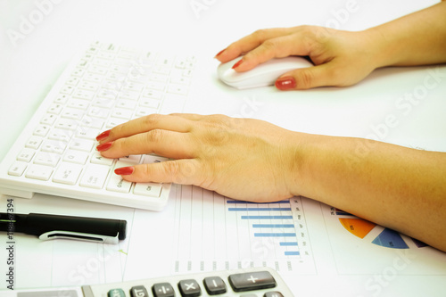 Asian business woman working with document and laptop in office