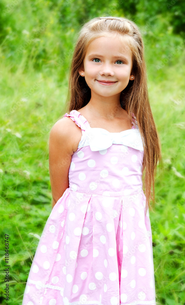 Portrait of adorable smiling little girl in summer day Portrait of adorable smiling little girl in summer day