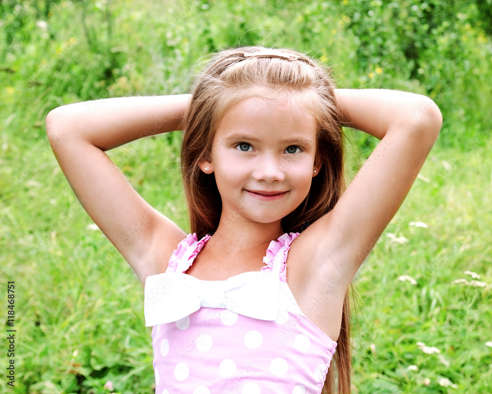 Portrait of adorable smiling little girl in summer day Portrait of adorable smiling little girl in summer day