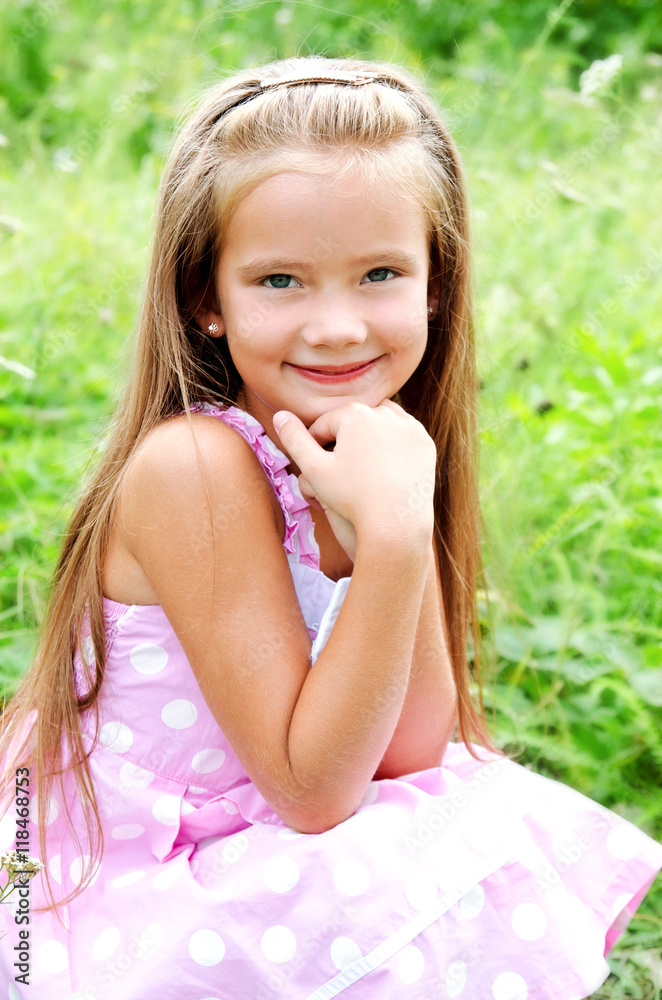 Portrait of adorable smiling little girl in summer day Portrait of adorable smiling little girl in summer day