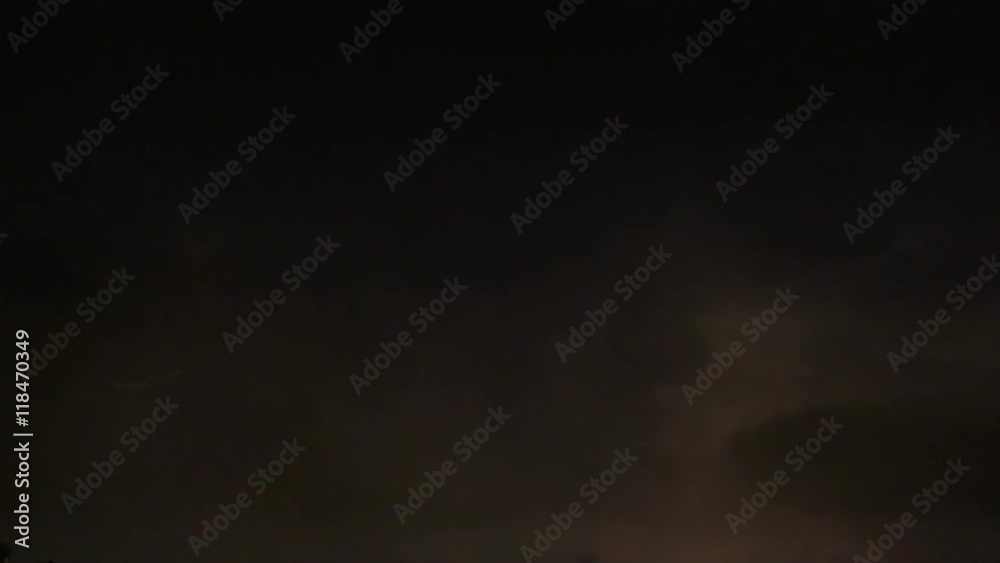 Multiple lightning forks flashing across dark night sky, thunderstorm with sound Multiple lightning forks flashing across dark night sky, thunderstorm with sound