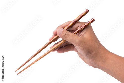 right hand witth chopsticks isolated on white background.