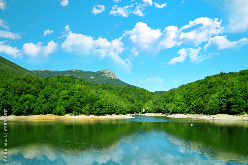 A Spanish landscape in Catalonia region. Montseny Mountains reflected on the Santa Fe Lake. Nature background and an empty copy space for Editor's text.