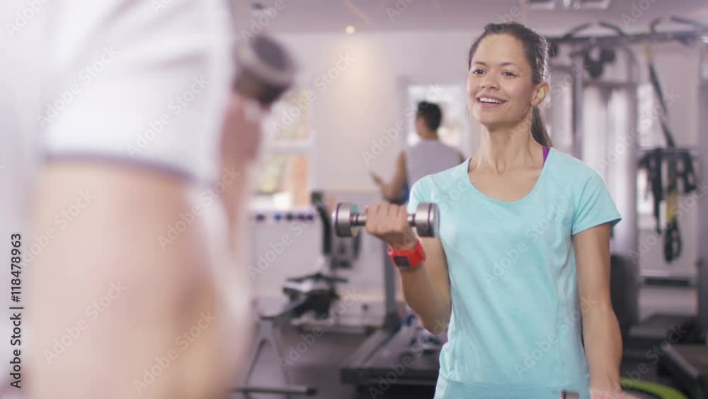 Woman working out with personal trainer at the gym Woman working out with personal trainer at the gym