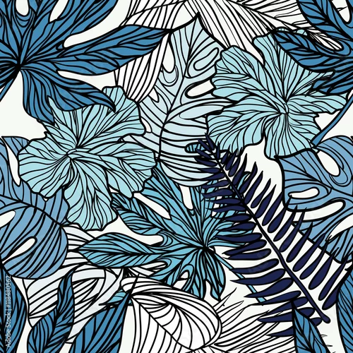 Obraz Tropikalne egzotyczne kwiaty i rośliny z zielonymi liśćmi palmowymi.