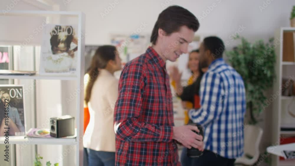 Portrait of smiling worker in creative office Portrait of smiling worker in creative office