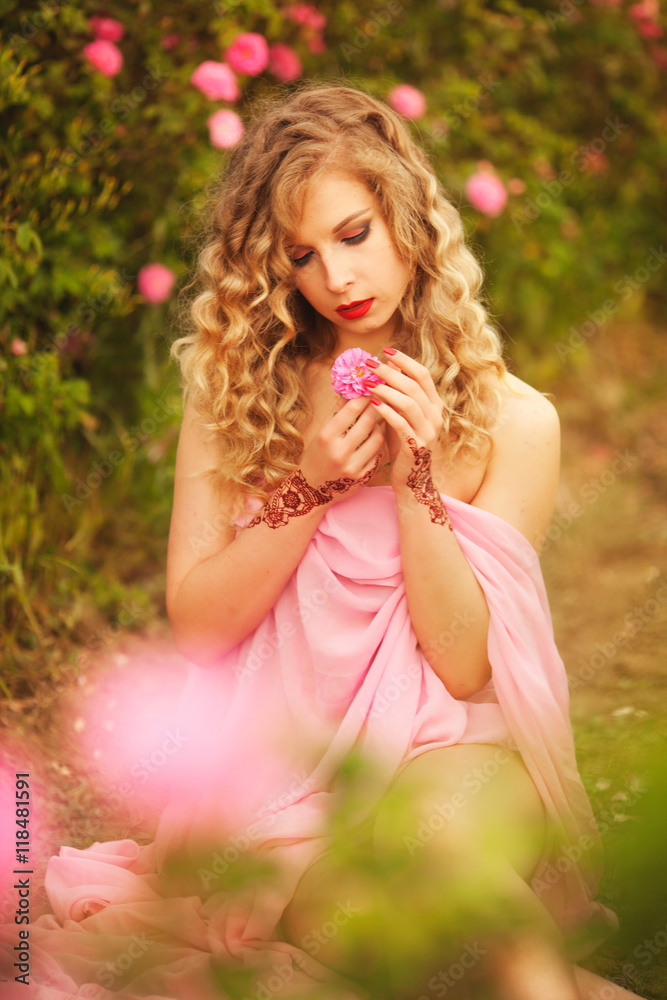 beautiful sexy girl in a pink dress standing in the garden roses beautiful sexy girl in a pink dress standing in the garden roses
