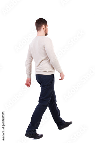 Back view of walking businessman. Rear view people collection. Backside view of person. Isolated over white background. The bearded man in a white warm sweater is sitting diagonally. 