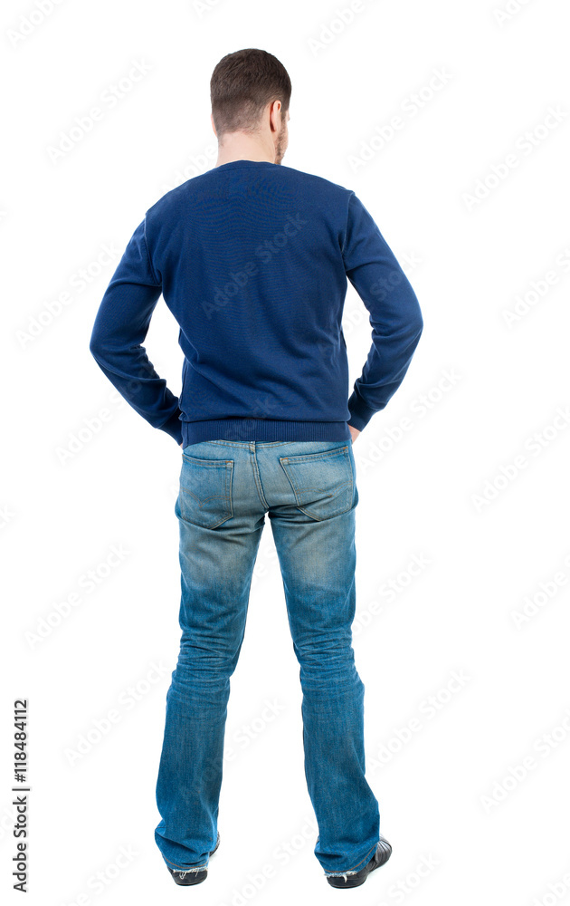 back view of Business man looks. Rear view people collection. backside view of person. Isolated over white background. bearded man in blue pullover standing with his hands in his trouser pockets. back view of Business man looks. Rear view people collection. backside view of person. Isolated over white background. bearded man in blue pullover standing with his hands in his trouser pockets.