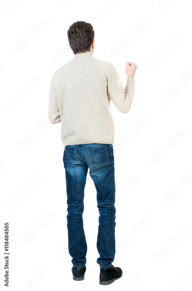 Back view of man . Standing young guy. Rear view people collection. backside view of person. Isolated over white background. Curly short-haired man in a woolen white jacket bent arm in a gesture of Back view of man . Standing young guy. Rear view people collection. backside view of person. Isolated over white background. Curly short-haired man in a woolen white jacket bent arm in a gesture of