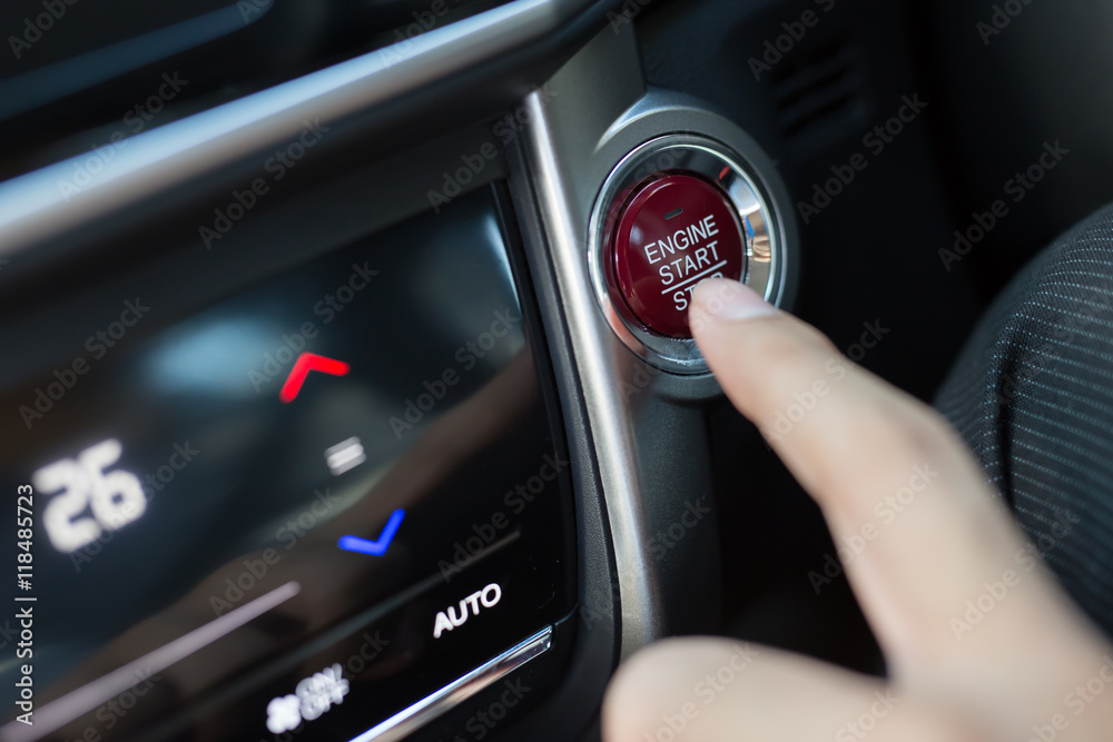 Car driver starting the engine Car driver starting the engine
