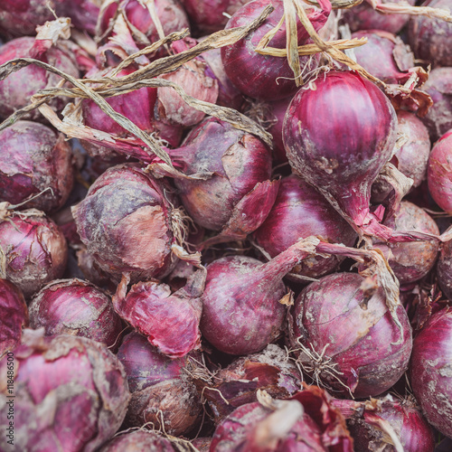 Red onion shallots placed in a box 