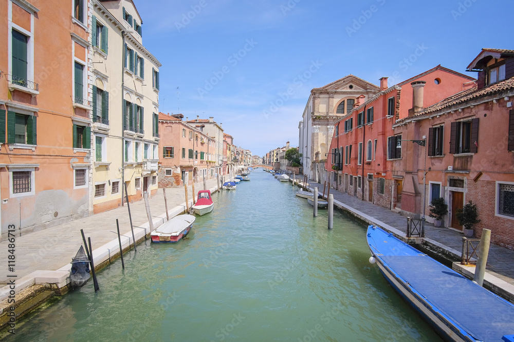 Venice, Italy, June, 21, 2016: landscape with the image of boats on a channel in Venice, Italy