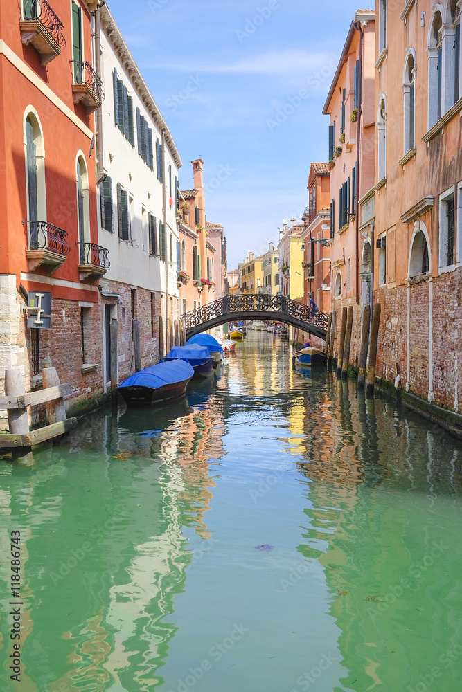 Venice, Italy, June, 21, 2016: landscape with the image of boats on a channel in Venice, Italy