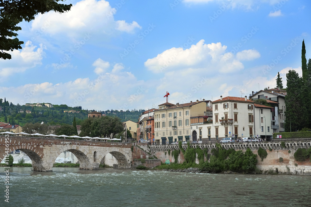VERONA, ITALY - JULY, 2, 2016: Embankment of river Adige in Verina, Italy VERONA, ITALY - JULY, 2, 2016: Embankment of river Adige in Verina, Italy
