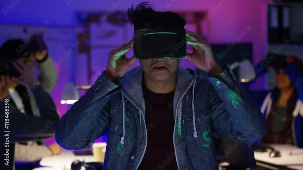  Young computer programmers trying out virtual reality viewers
