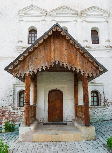 Antique carved wooden porch - sample of ancient Russian architecture