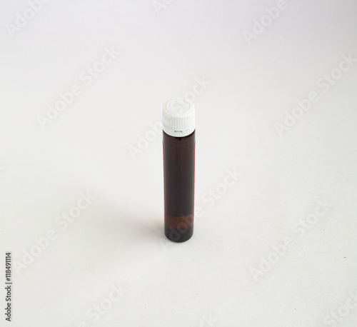 Dark vial on a white background