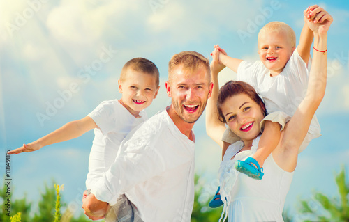 Happy young family with two children having fun together
