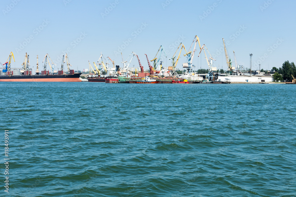 Cargo commercial port within the city with cranes and ships