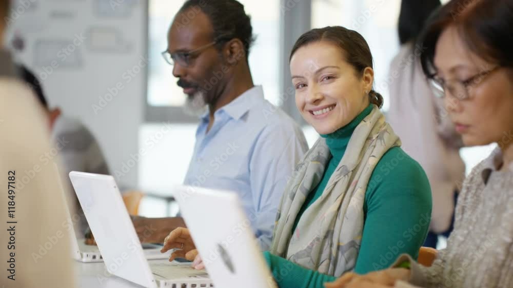  Portrait of smiling mature student in adult education class