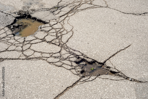 Pothole in Montreal with many cracks