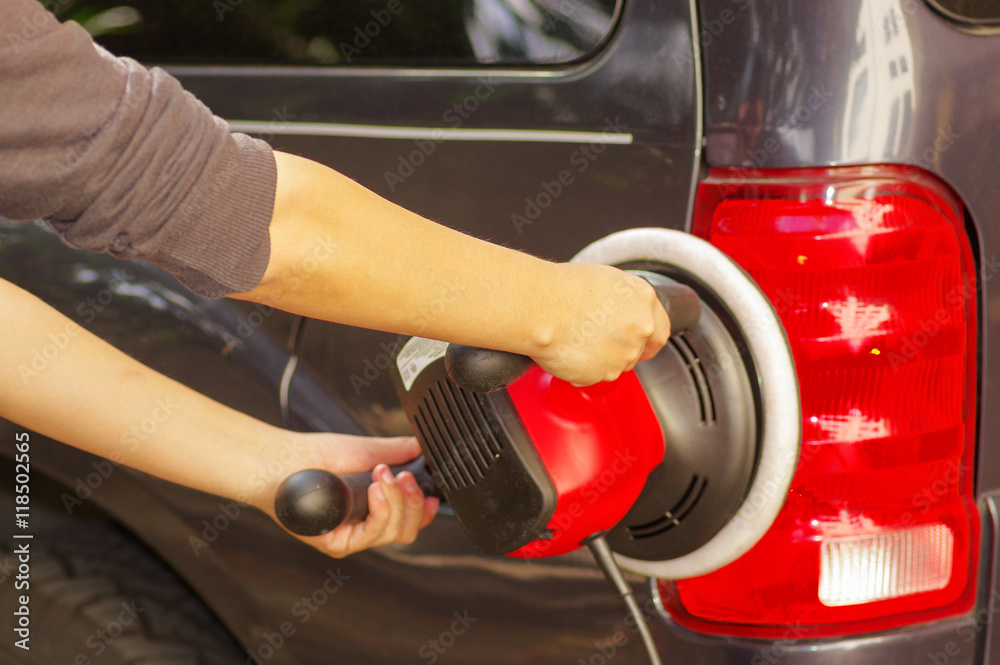 power buffer cleaning the tail lights of a car power buffer cleaning the tail lights of a car