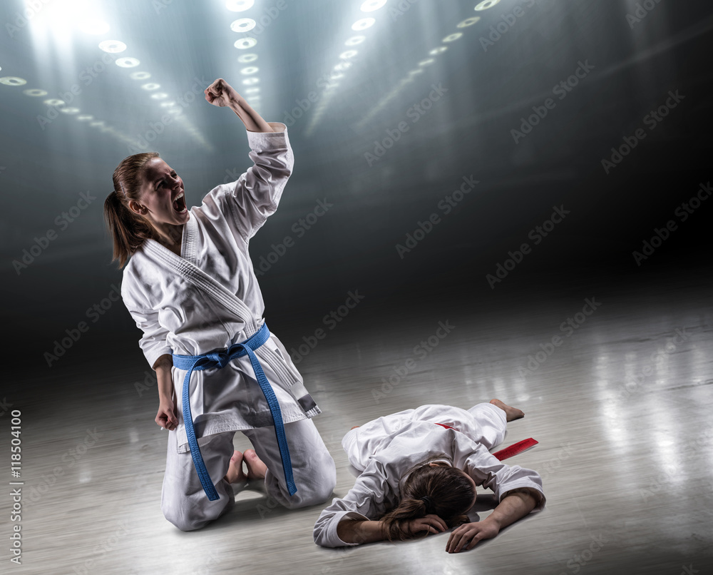 Sexy girl in a kimono karate rejoices victory foto de Stock | Adobe Stock