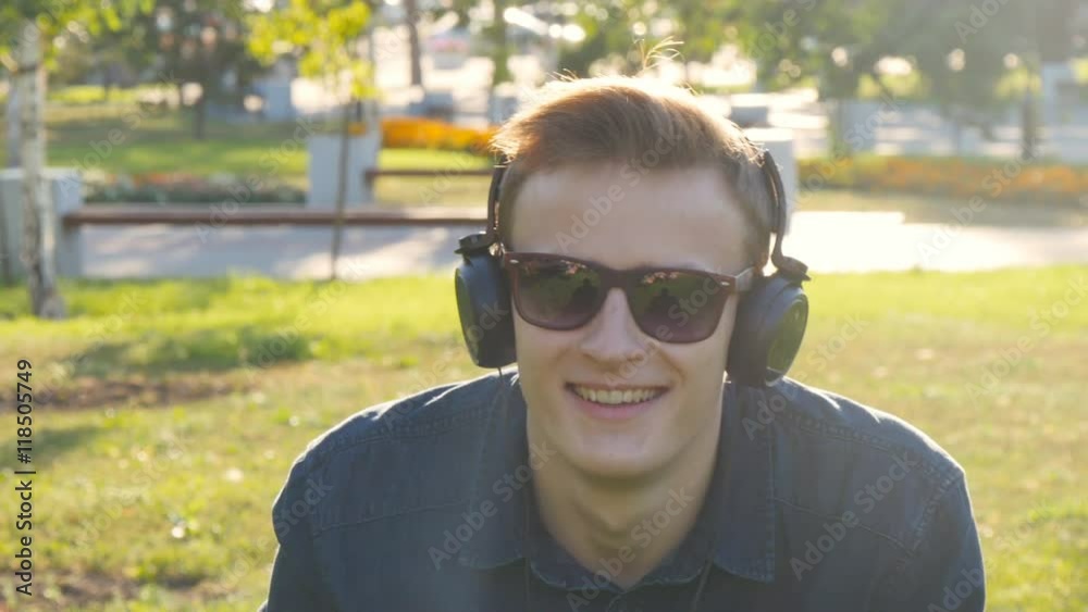 Man with sunglasses relaxing on the grass Man with sunglasses relaxing on the grass