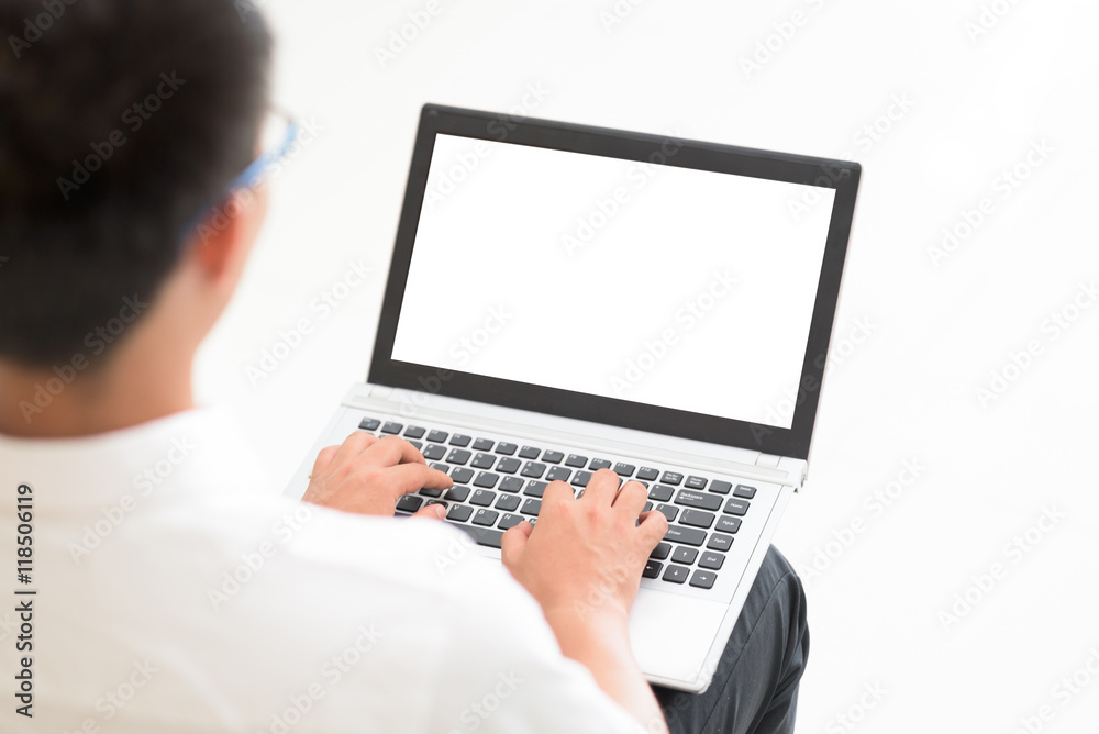 Young man using laptop for work. Young man using laptop for work.