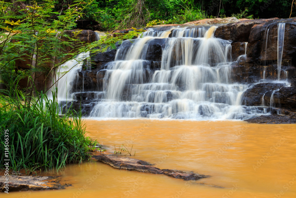 Fototapeta premium Orange waterfall in Thailand