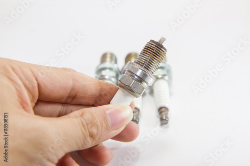 Used spark plug on the hand