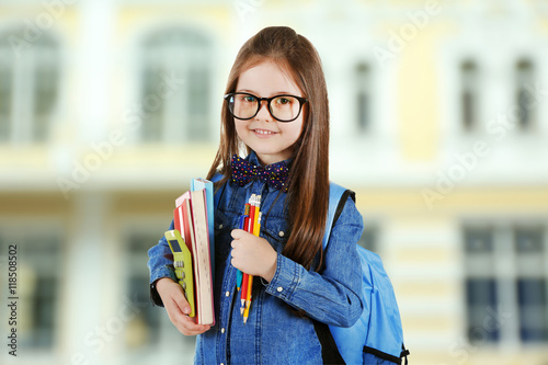 Cute little girl with blue ...