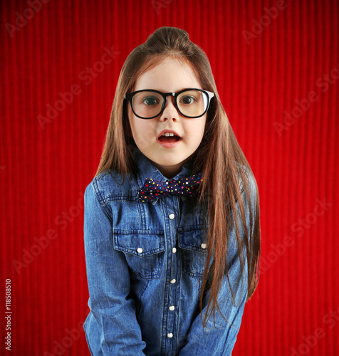 Cute girl wearing glasses o...