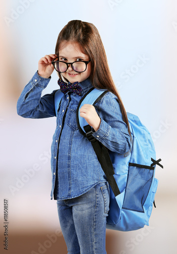 Cute girl wearing glasses a...