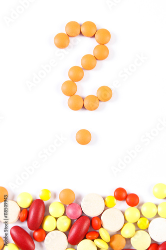 Question mark made of medical pills and tablets on white background  health care concept