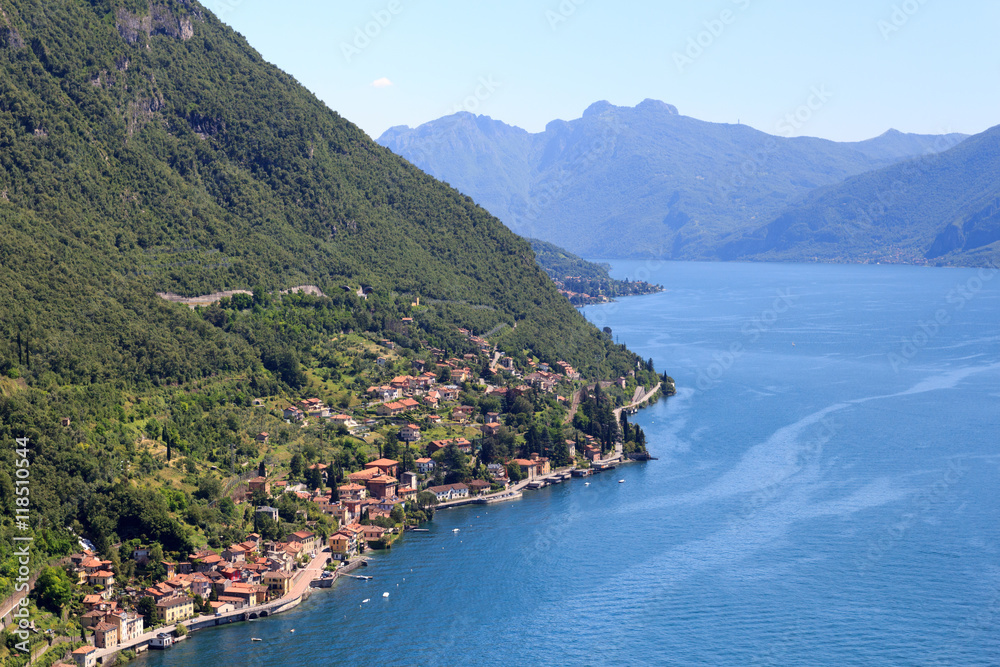 Panorama of lakeside village Fiumelatte at Lake Como with mountains in Lombardy, Italy