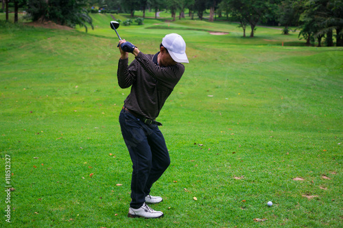 Male golf player in Golf court is Surrounded  natural
