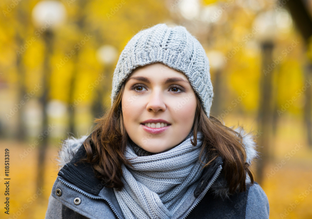Young and beautiful girl posing in an autumn park Young and beautiful girl posing in an autumn park