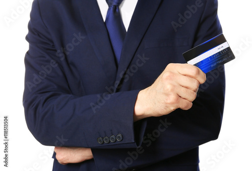 Businessman with credit card on white background