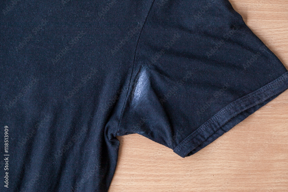 Shirts dirty caused by roll- on deodorant on wooden background Shirts dirty caused by roll- on deodorant on wooden background