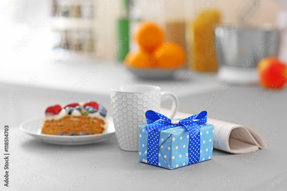 Happy Fathers Day concept. Tea cup with presents on table Happy Fathers Day concept. Tea cup with presents on table