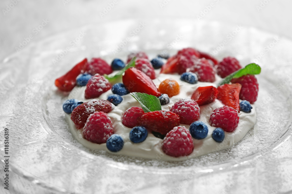 Berries and cream on plate Berries and cream on plate