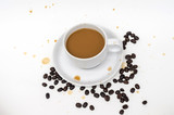 coffee in white cup with coffee beans and coffee stain
