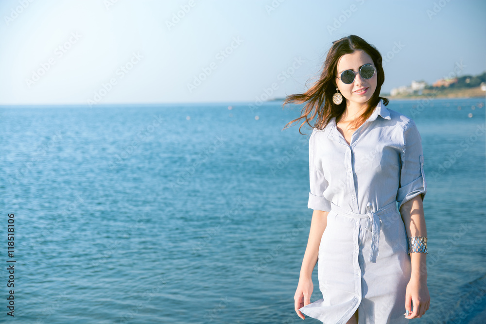 portrait of beautiful young woman with glasses near the sea portrait of beautiful young woman with glasses near the sea