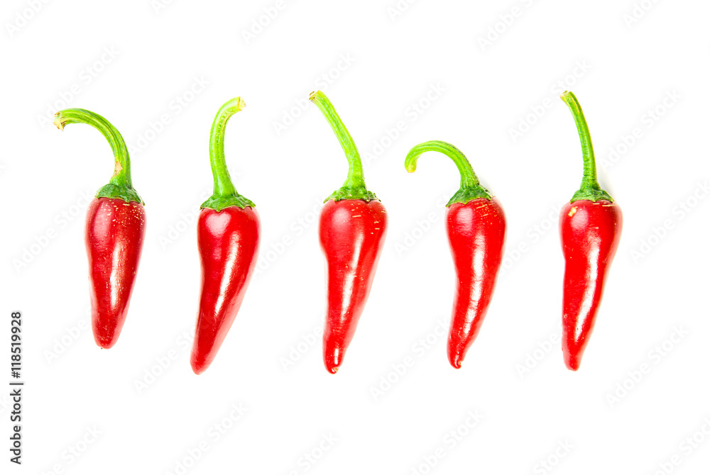 Five ripe red Chilli peppers on white