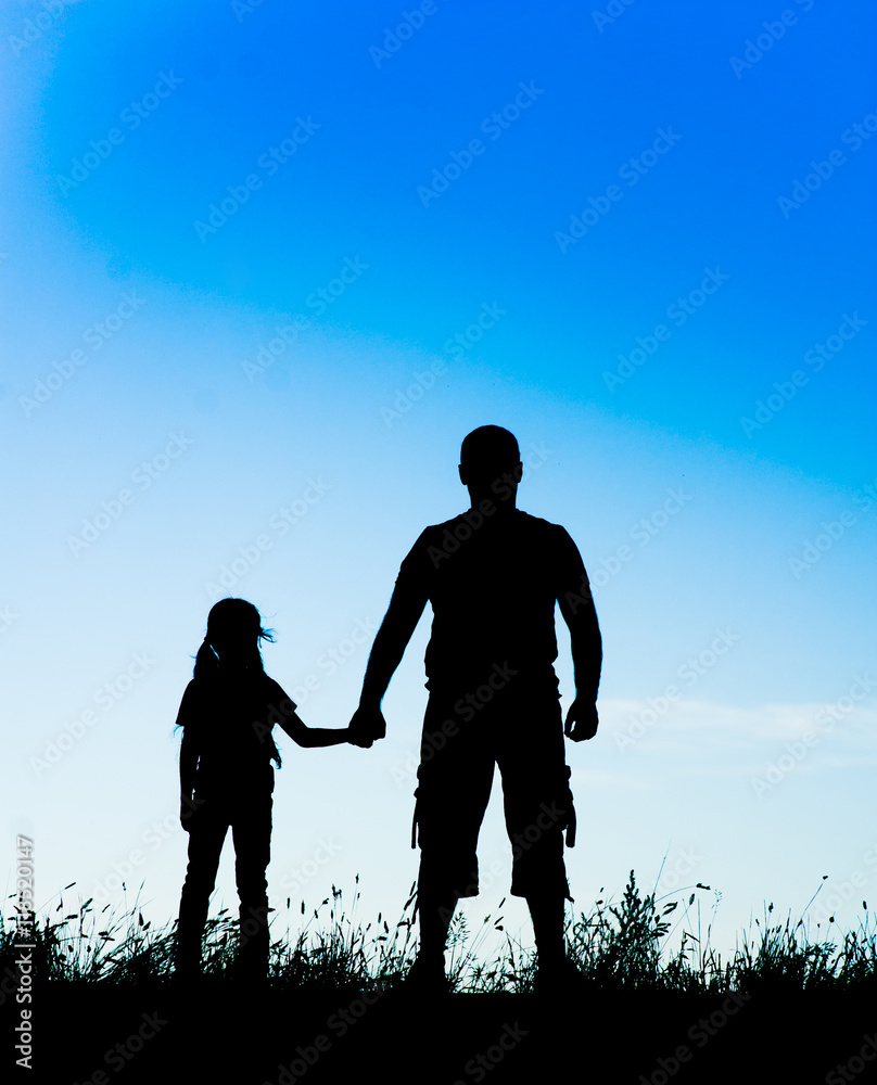 silhouette father and daughter holding hands